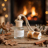 Fireside Marshmallows car diffuser by a cozy fireplace