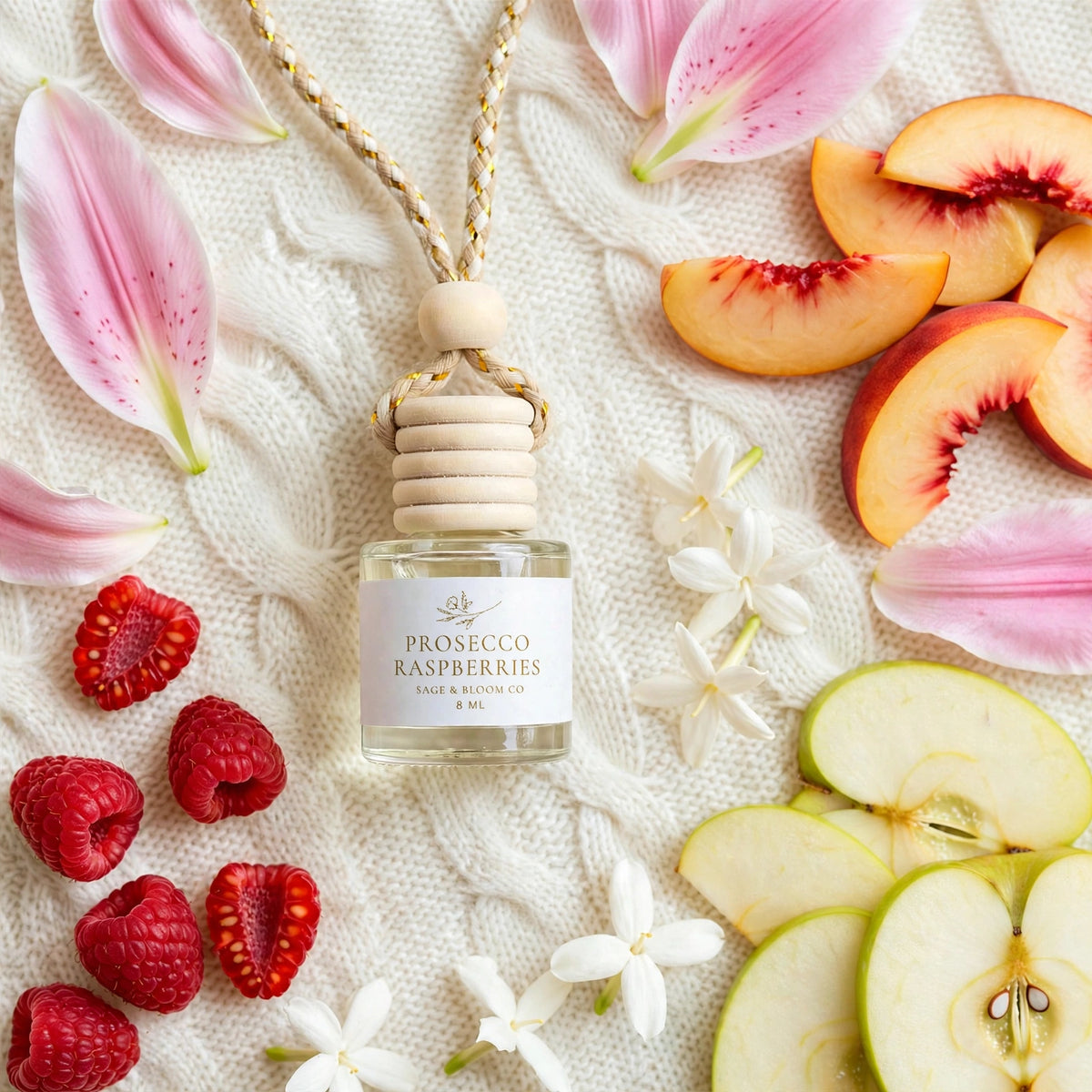 Prosecco Raspberries car diffuser flat lay with raspberries, apple, peach, lily petals and jasmine