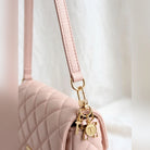 Bow Initial Bag Charm - Letter Charm T clipped to a purse ring