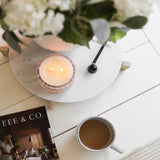 Blushing Peony vintage glass candle lifestyle photo