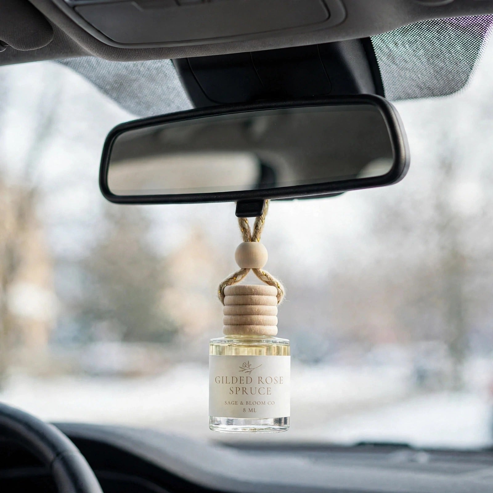 Gilded Rose Spruce in car on rearview mirror