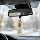 Gilded Rose Spruce in car on rearview mirror