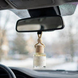 Gilded Rose Spruce in car on rearview mirror