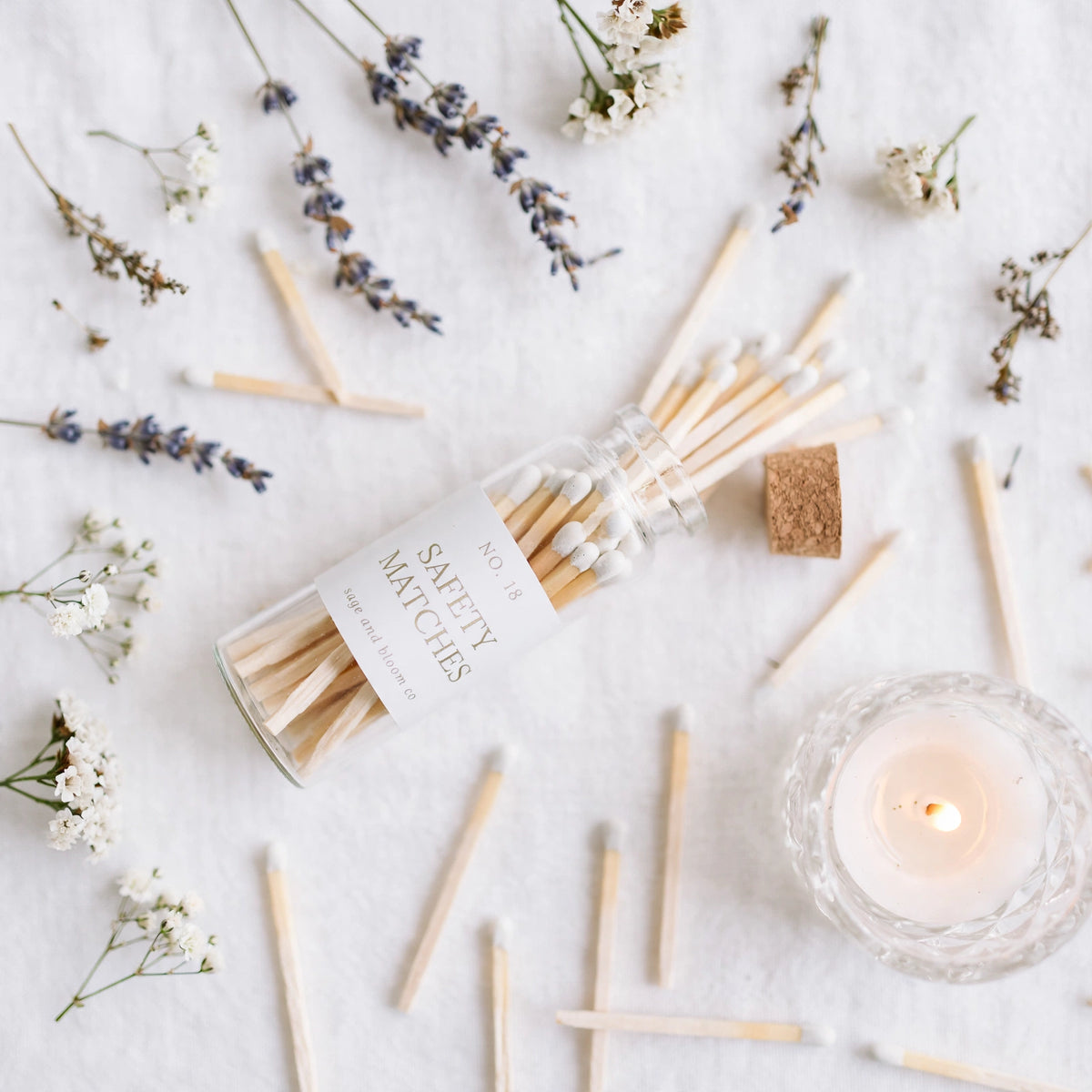 Mini Apothecary Matches flat lay with lavender and lit candle
