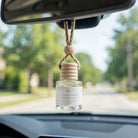 Cashmere Vanilla car diffuser hanging behind the rearview mirror on a summer drive