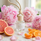 Pink Peony Grapefruit car diffuser styled with fluffy pink peonies and grapefruit