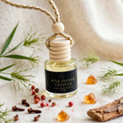 Pink Pepper Vetiver car diffuser styled with pink peppercorns, vetiver grass, cloves and amber