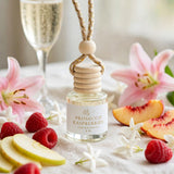 Prosecco Raspberries car diffuser styled with champagne, raspberries, pink lilies and jasmine