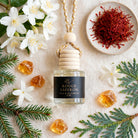 Rouge Saffron car diffuser flat lay with jasmine, saffron, fir, cedar and amber