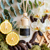 Tonka Sandalwood car diffuser flat lay with eucalyptus, bergamot, orchid, tonka beans and sandalwood