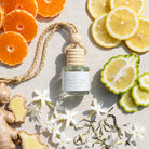 White Tea Jasmine car diffuser flat lay with mandarin, lemon, bergamot, ginger, jasmine and white tea