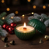 Christmas ornament candle burning with wooden wick flame