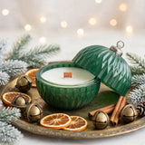 Nordic Nights Christmas ornament candle, open on antique brass tray with muted gold holiday styling