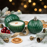 Pair of Christmas ornament candles, one open one closed