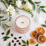 Sea Salt Orchid candle flat lay with dried orange slices, tonka beans, freesia and sea salt