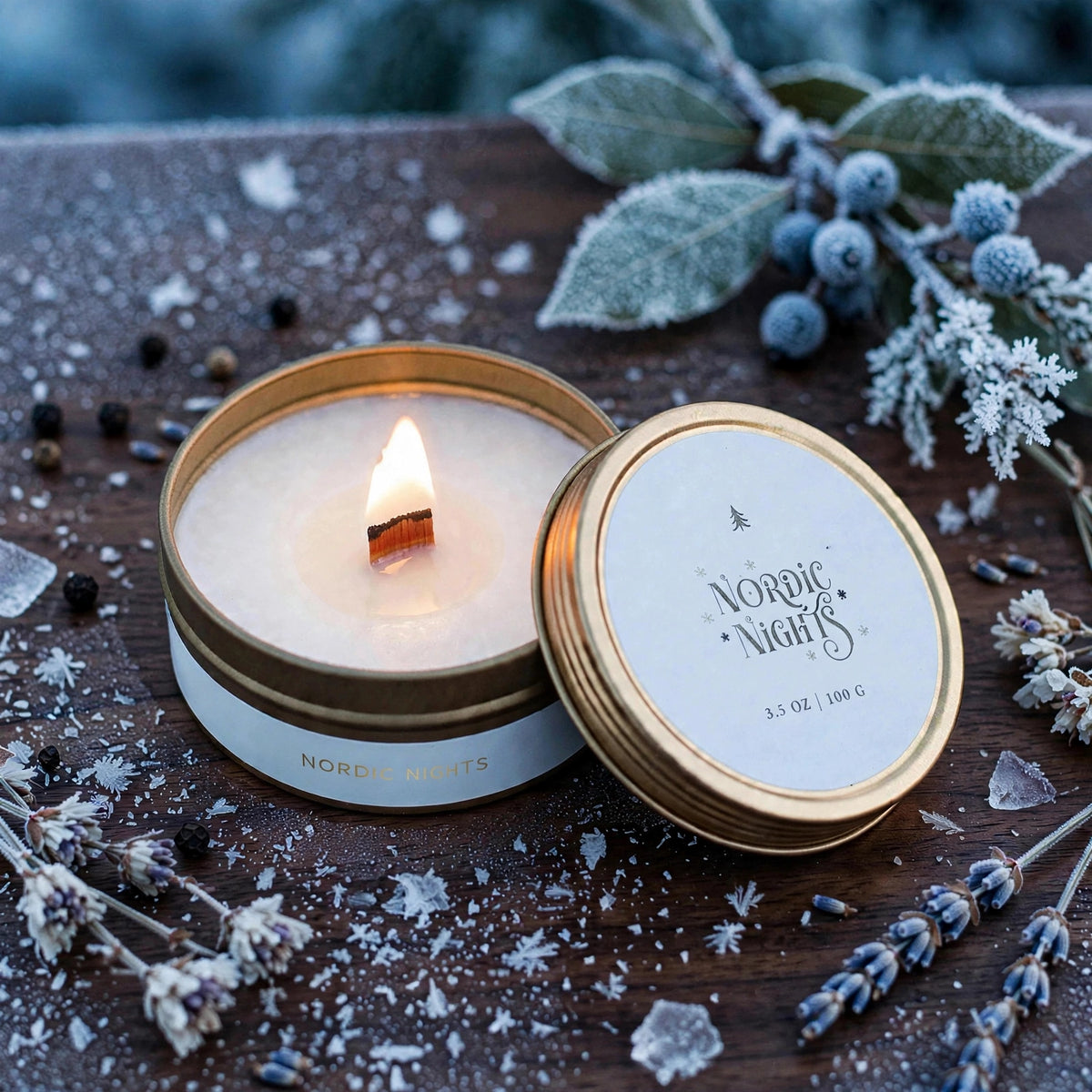 Lit Nordic Nights travel tin candle with wooden wick on frosted walnut