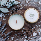 Open unlit Nordic Nights travel tin candle showing wooden wick