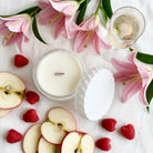 Prosecco Raspberries vintage glass candle flat lay