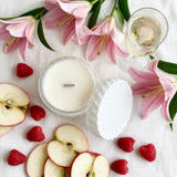Prosecco Raspberries vintage glass candle flat lay