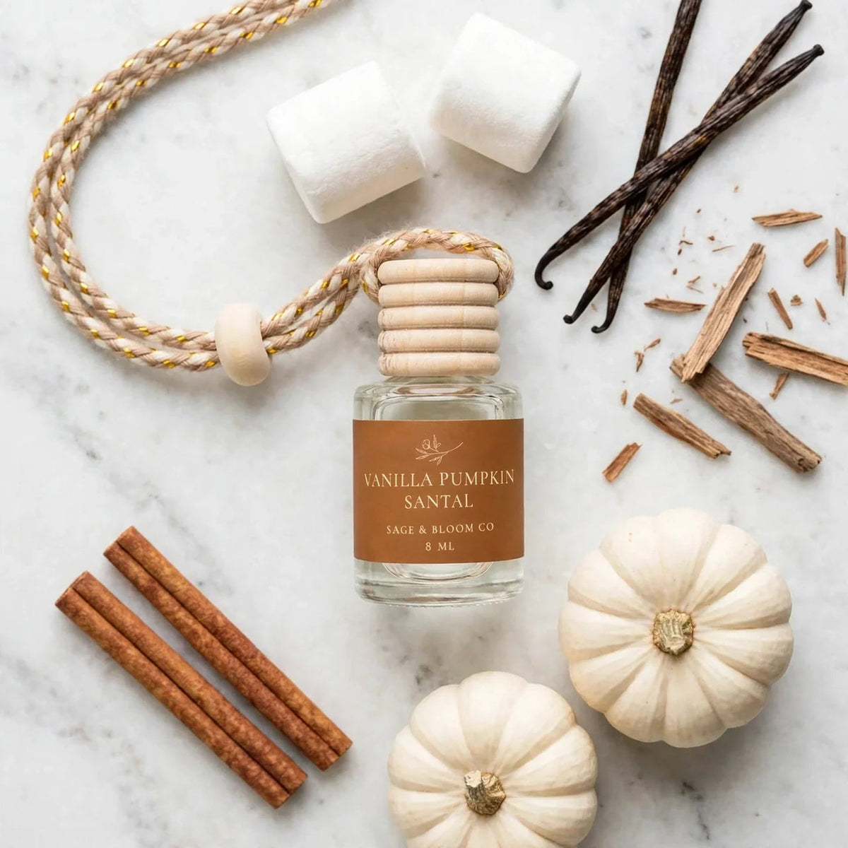 Vanilla Pumpkin Santal car diffuser clean flat lay with white pumpkins and marshmallows