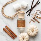 Vanilla Pumpkin Santal car diffuser clean flat lay with white pumpkins and marshmallows